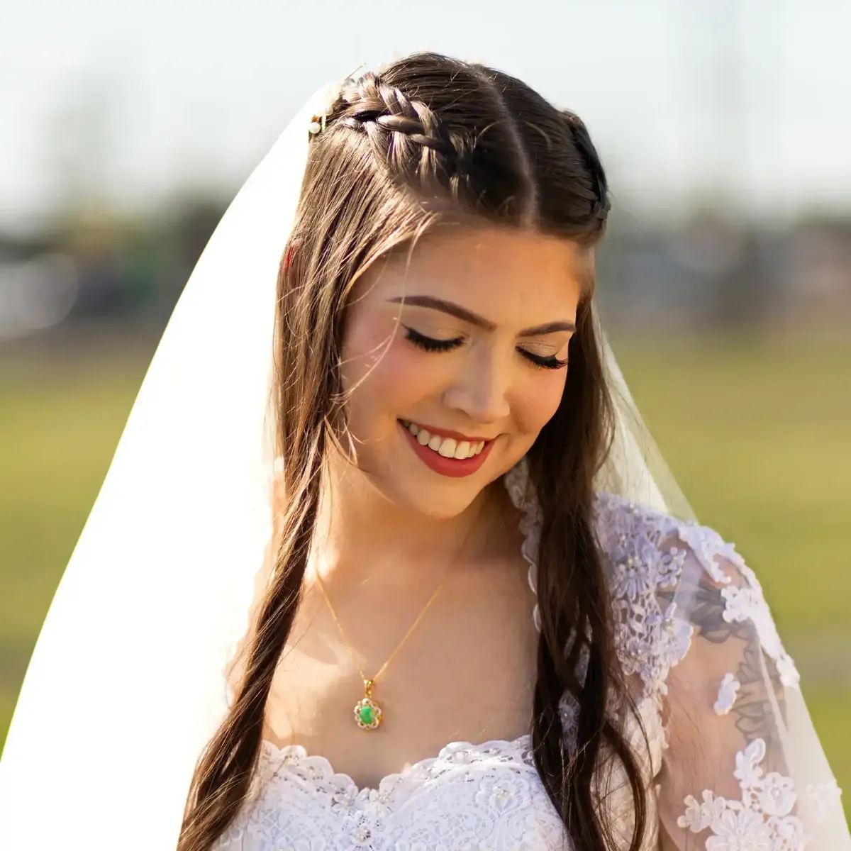 Bride smiling softly in her veil