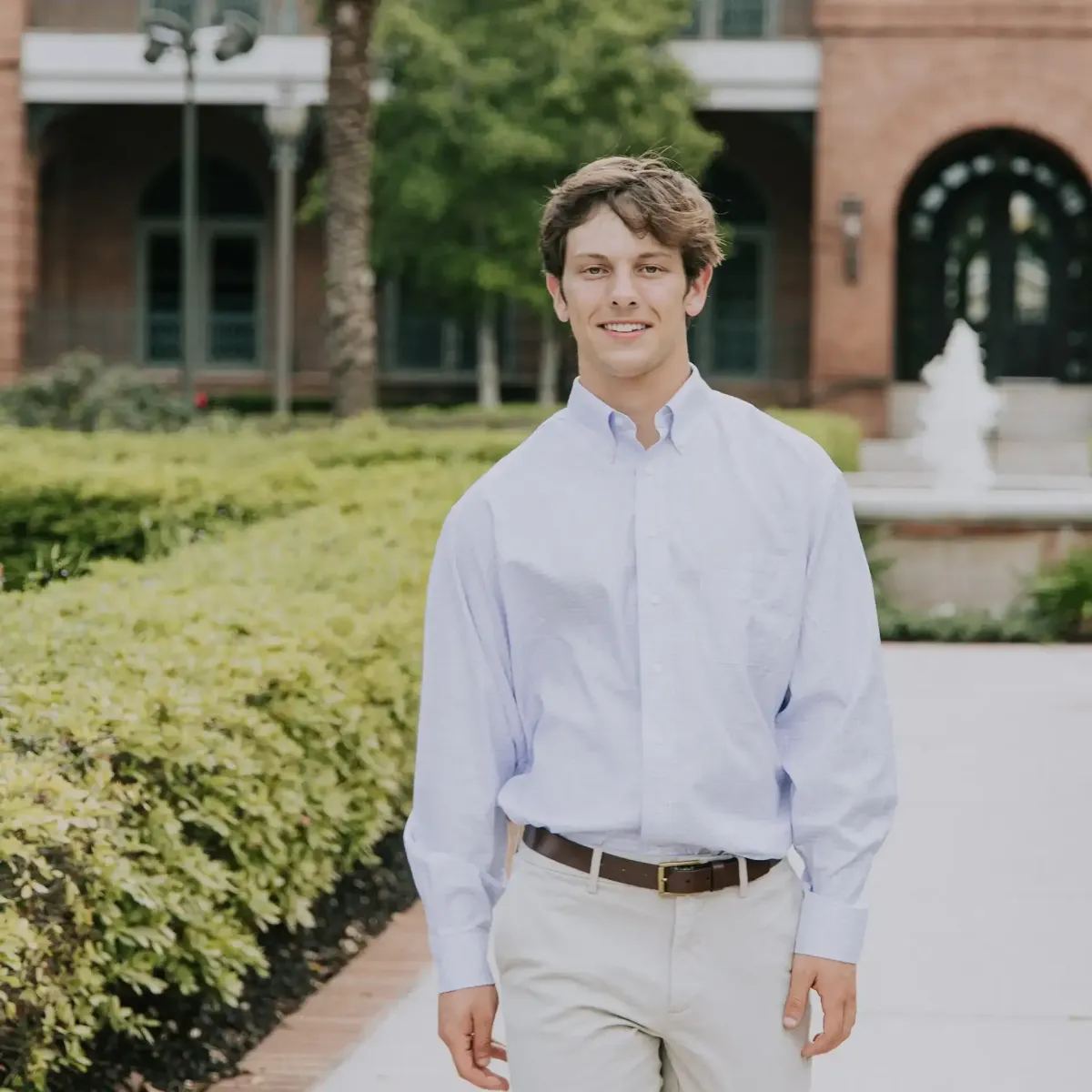 Senior portrait in a garden courtyard