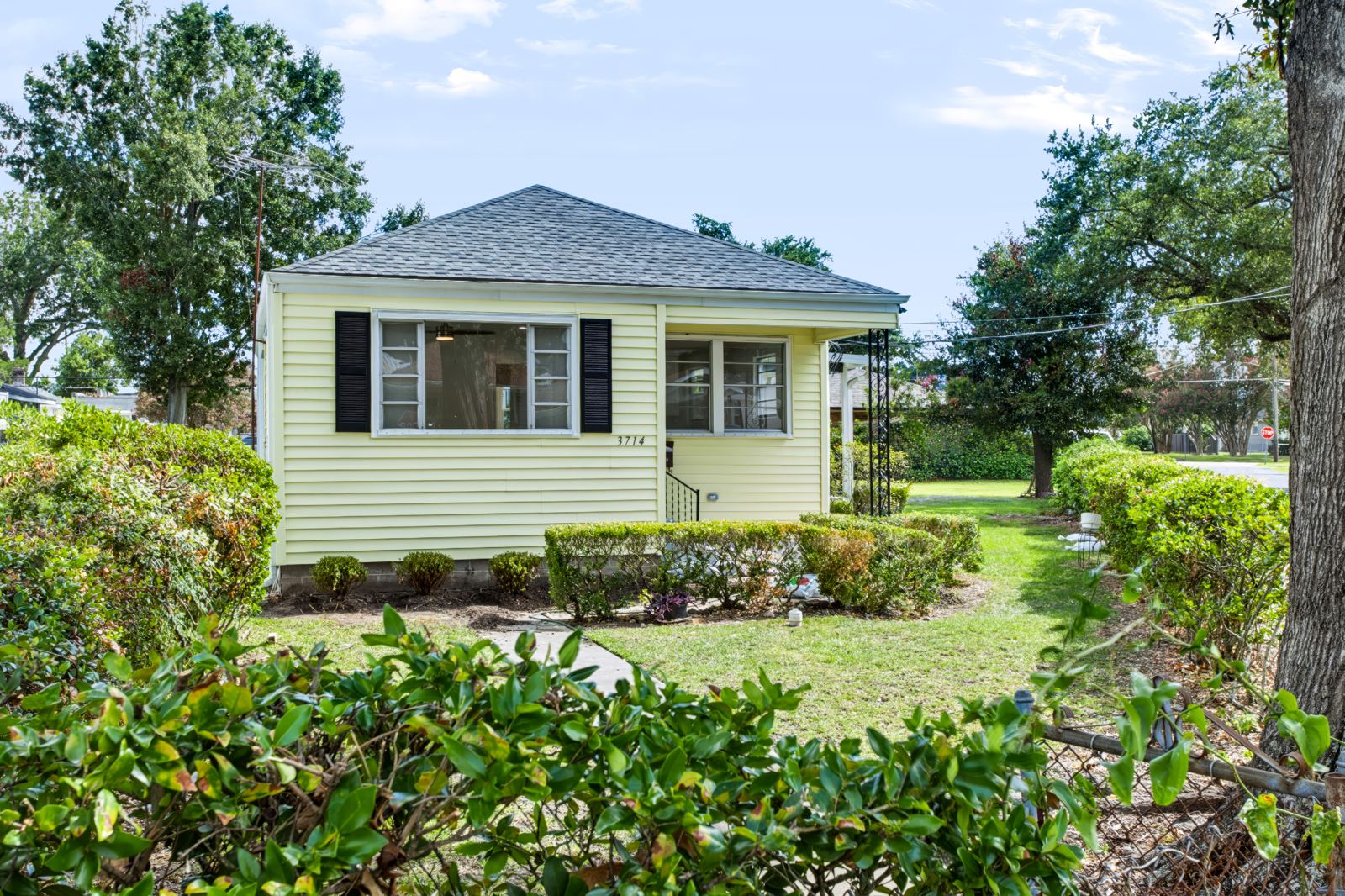 Refreshed cottage listing with landscaped front yard