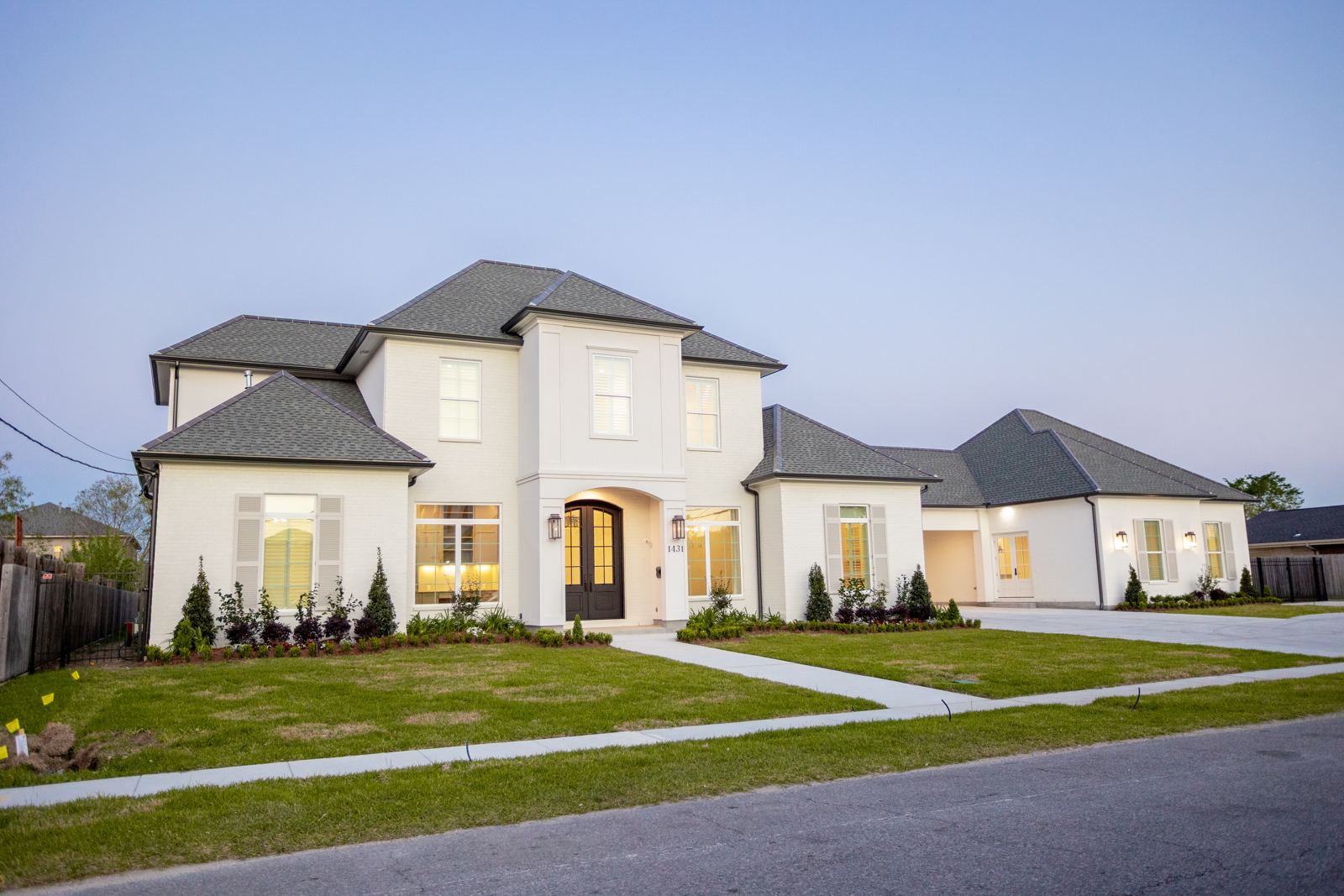 Front exterior of a two-story home at dusk