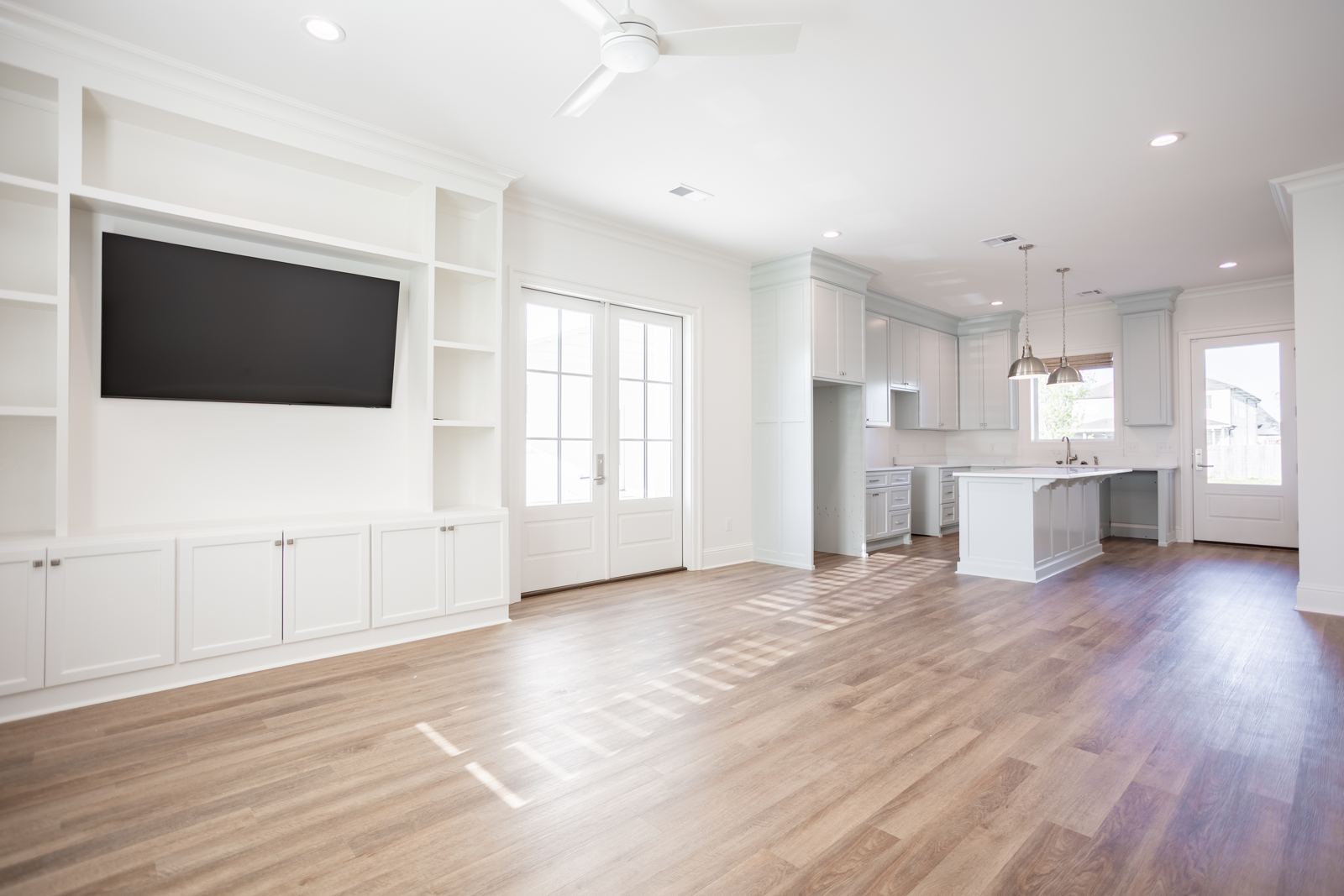 Living room with built-in shelving and media wall