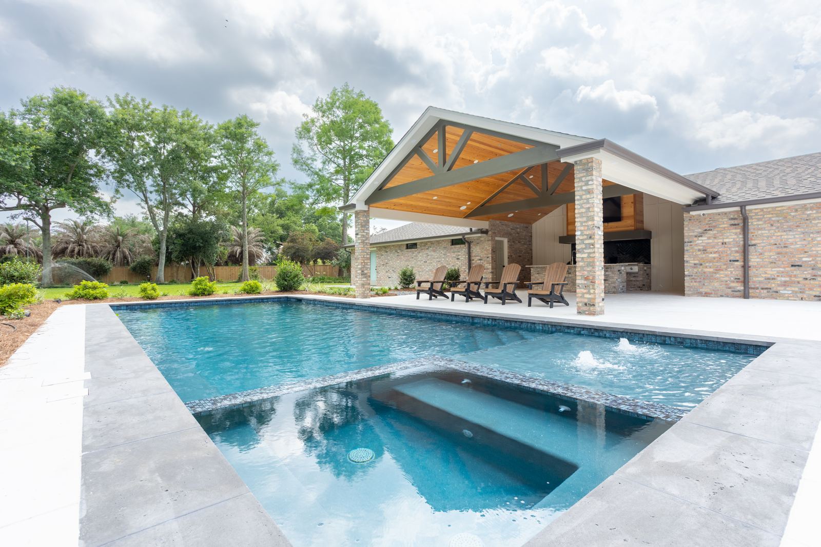 Backyard pool and covered outdoor kitchen in Destrehan